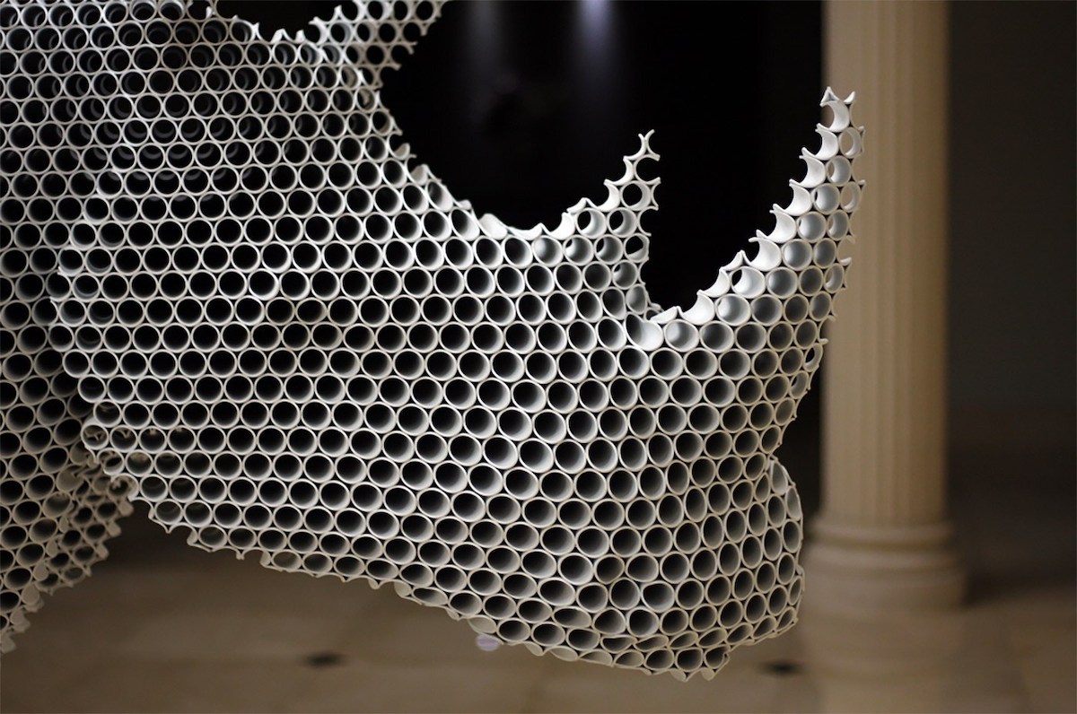Sculptor Creates Mesmerizing Halftone Sculptures from Hundreds of Metal Pipes