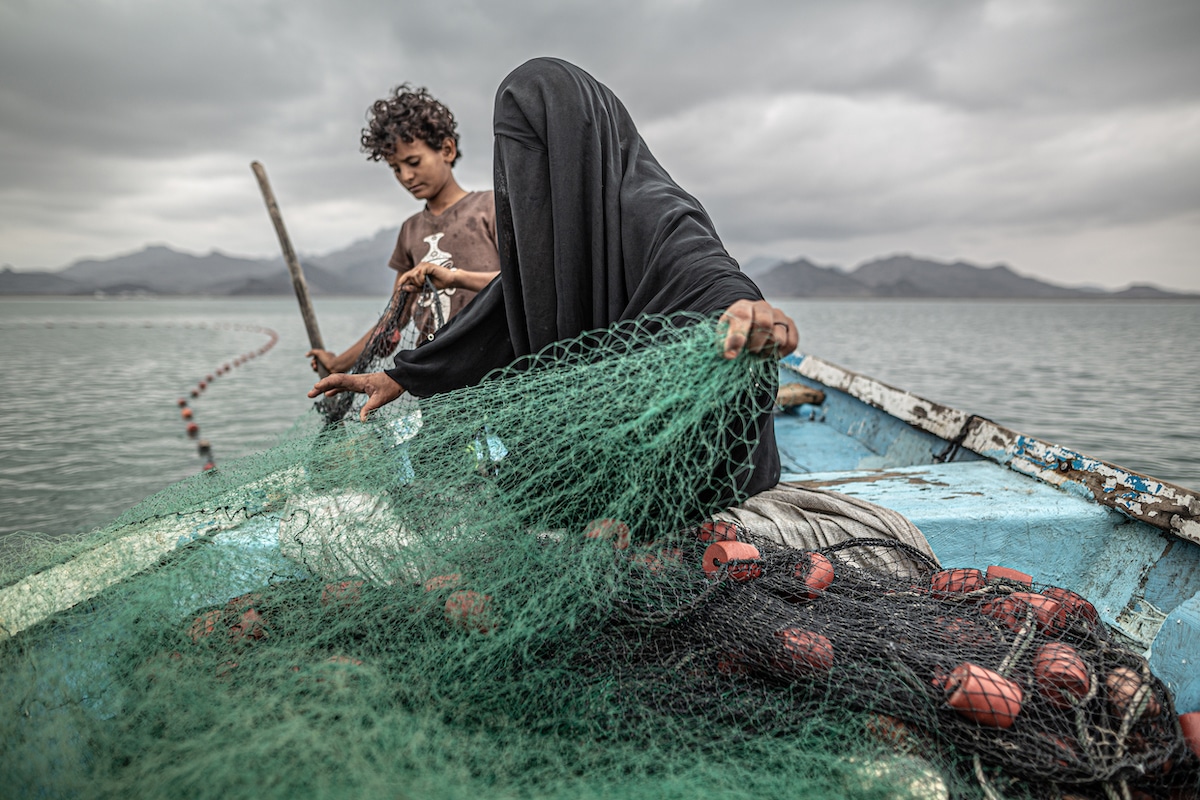 Woman and Son in Yemen Fishing