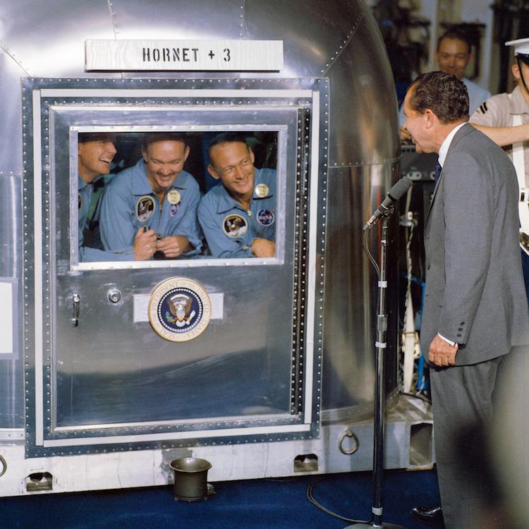 President Richard Nixon visiting the Apollo 11 crew aboard the USS Hornet.