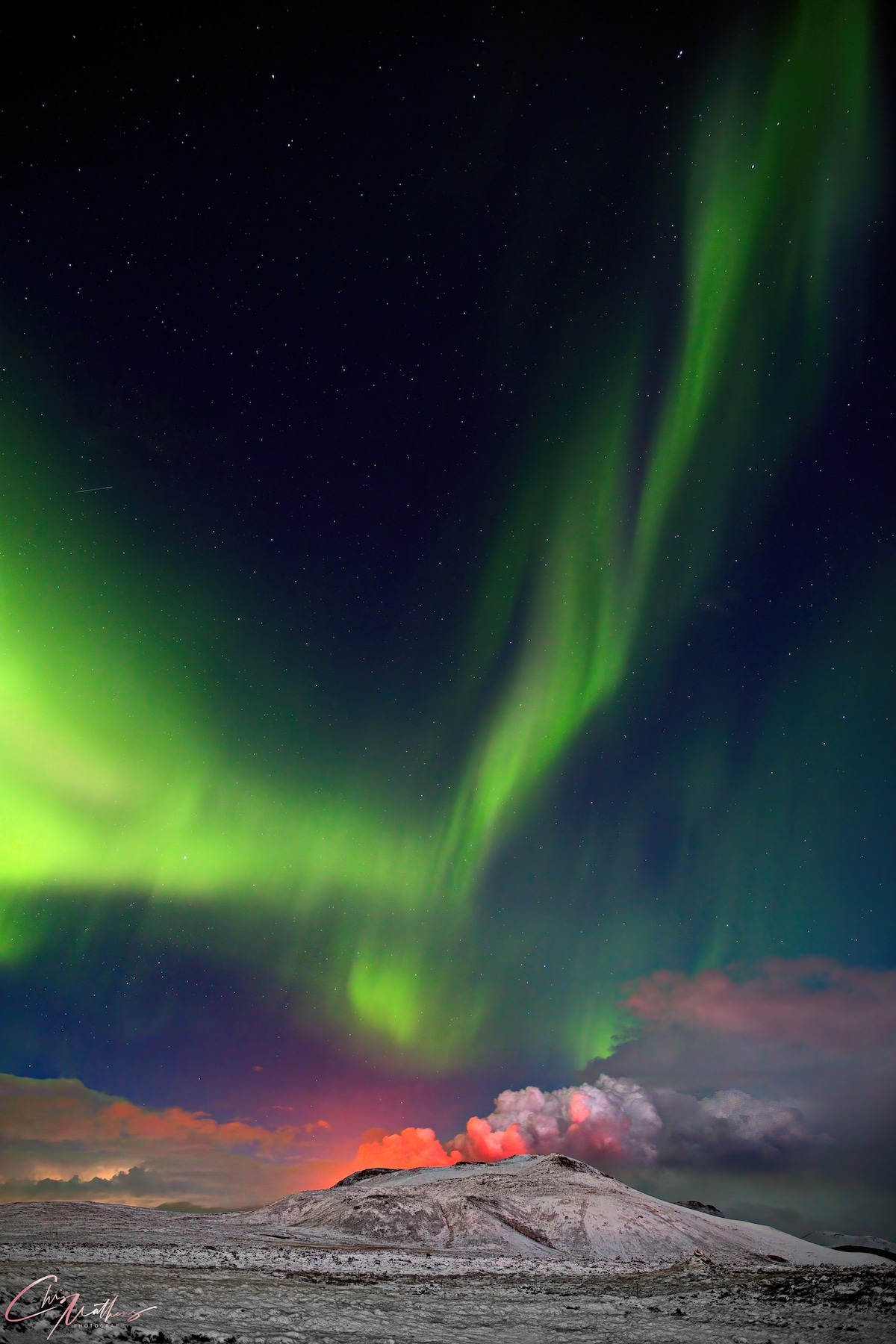 Aurora Borealis Over Erupting Geldingadalur volcano in Iceland