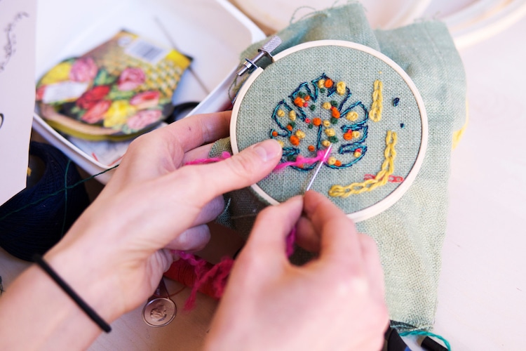 Person Stitching in an Embroidery Hoop