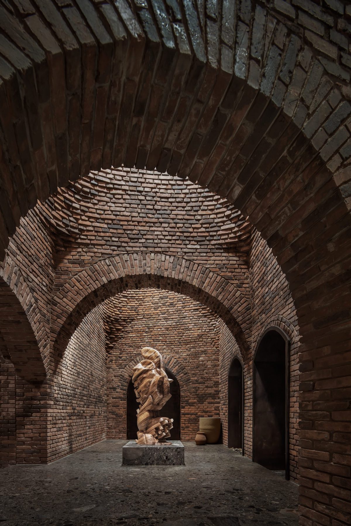 Brick Interior With Abstract Sculpture in the Middle