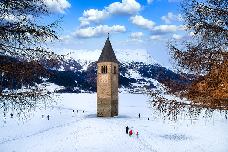 Lake Resia and Curon Tower in Winter