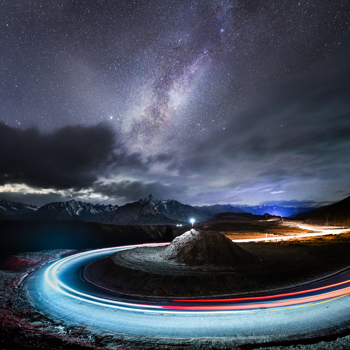 Streaking Car Lights Under the Milky Way