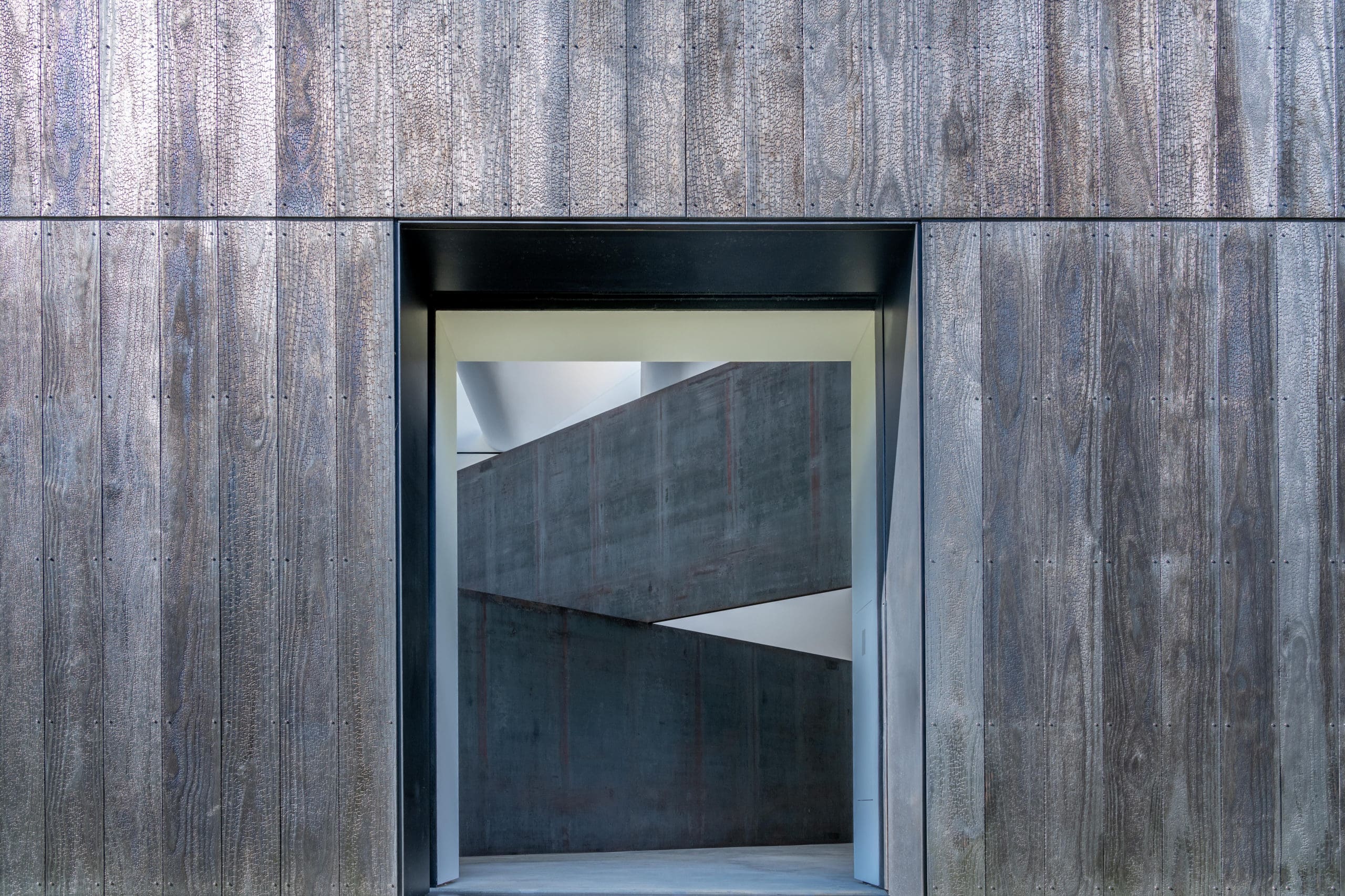 Minimal Charred Timber Container LX Pavilion Houses Richard Serra’s Sculpture London Cross