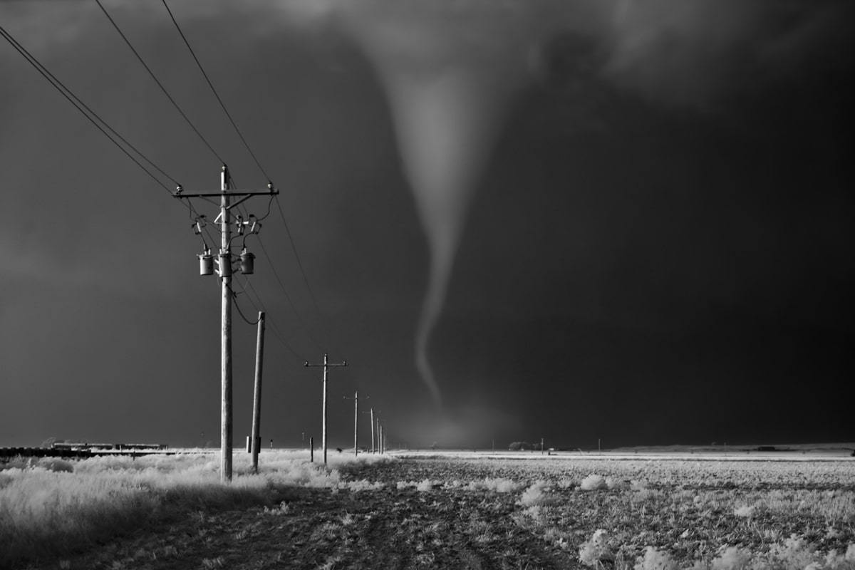 Tornado Crossing Power Poles by Mitch Dobrowner