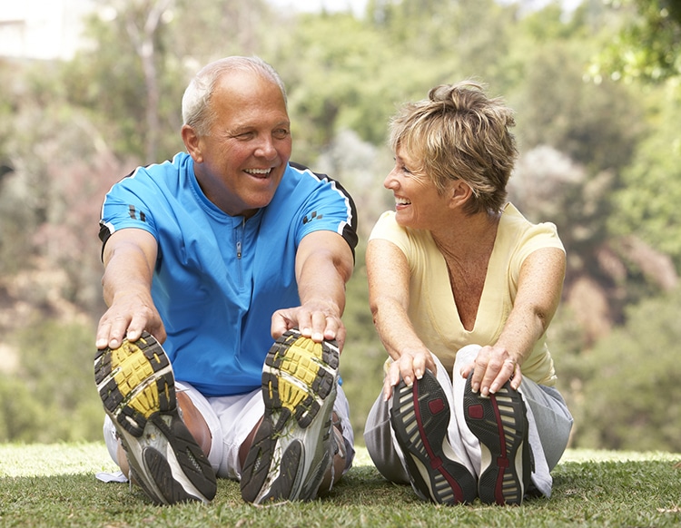 Senior Couple Exercising In Park, Metabolism Declines after 60