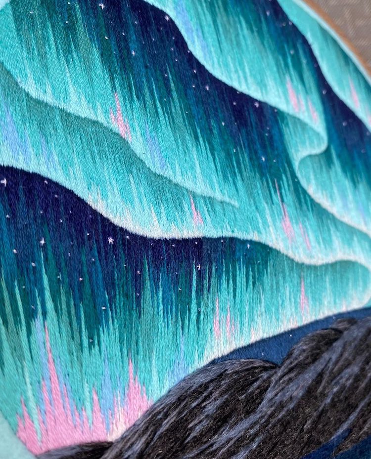 Hoop Art Featuring Northern Lights Over Mountains