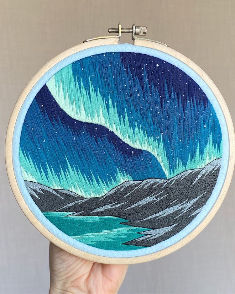 Hoop Art Featuring Northern Lights Over Mountains