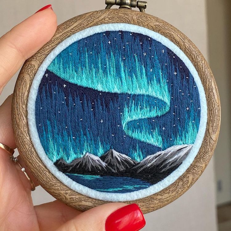 Embroidery Art of a Mountain Landscape and Northern Lights