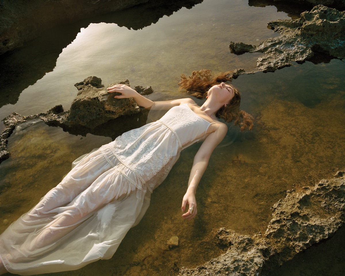Girl Floating in Water by Rania Matar