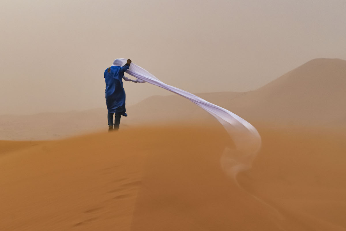Man in the Sahara Desert During a Sandstorm