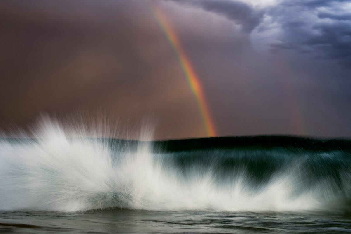 Crashing Wave with Rainbow by Ray Collins