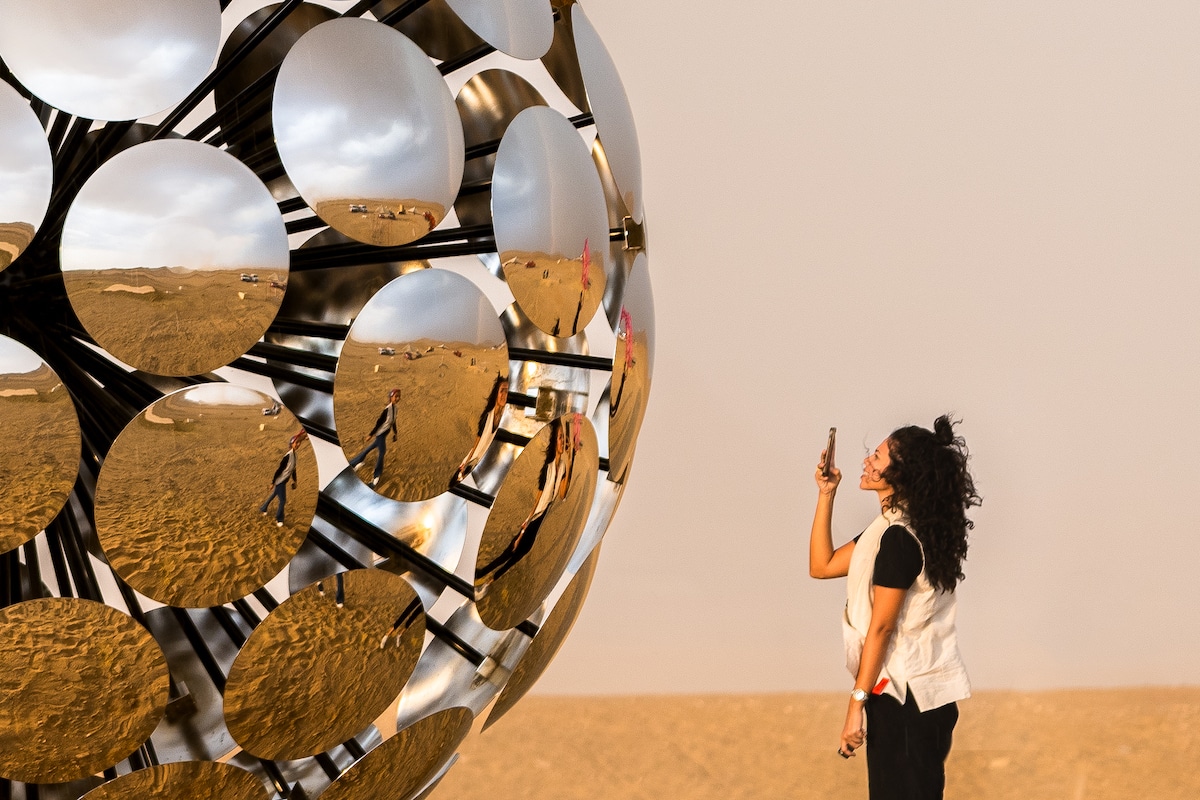 Girl Taking Photo in Reflection of SpY's ORB in Egypt