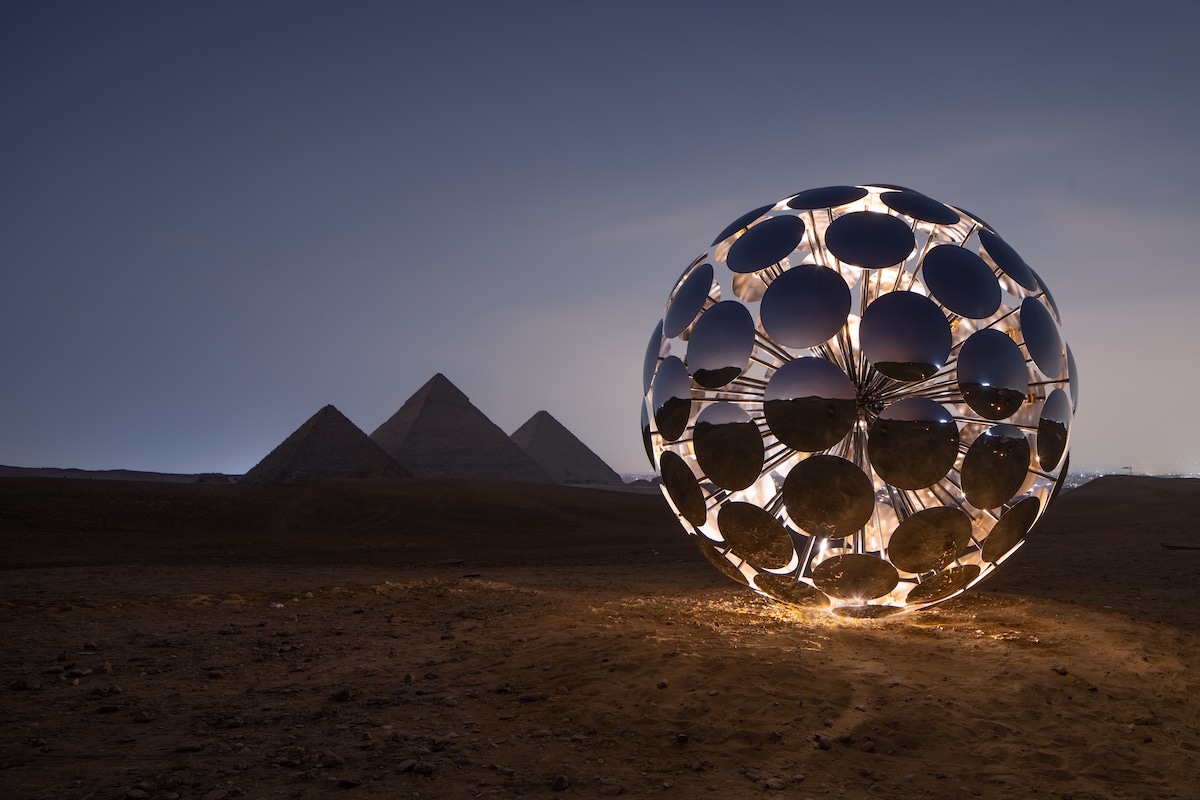 SpY Art Installation at Night in Front of the Pyramids in Giza