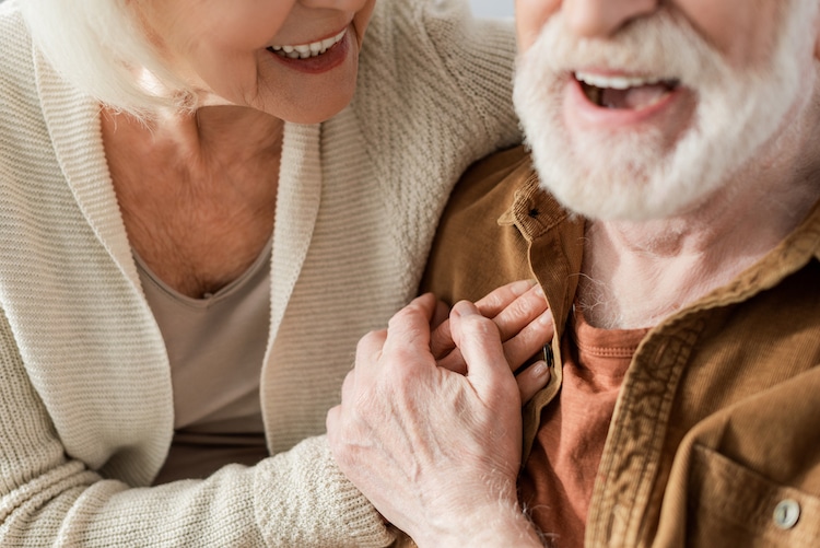 Elderly couple laughing together