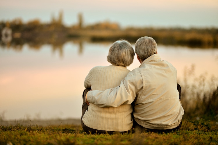 elderly couple looking at the water