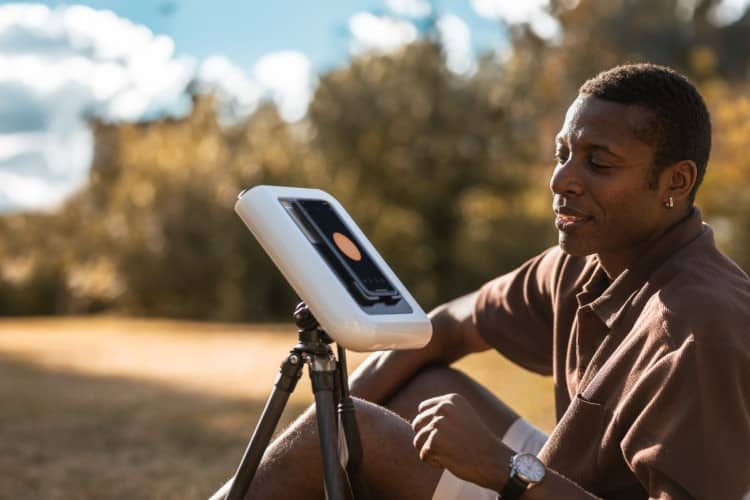 Man Using the Hestia Smartphone Telescope