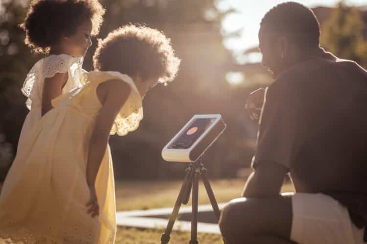 Family Looking at a Hestia Smartphone Telescope