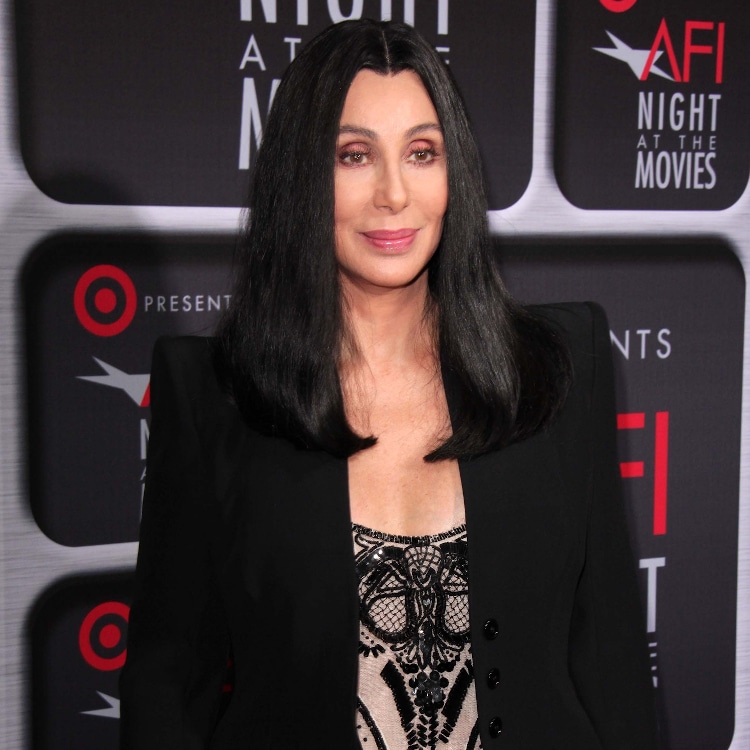 Cher posing at a red carpet