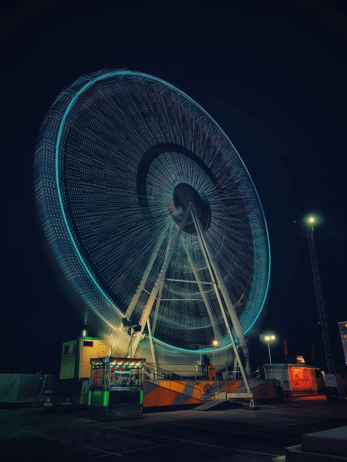 Illuminated ferris wheel at night