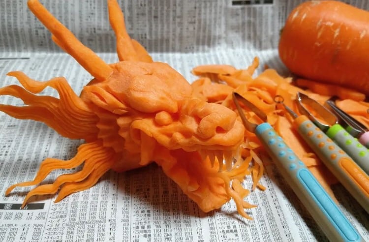 Dragon head carved out of a carrot