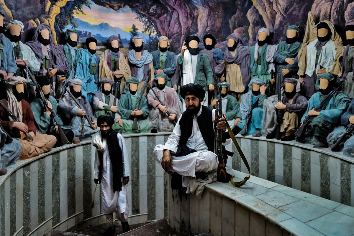 Staircase lined with lifelike puppets of Mujahideen fighters at the Herat jihad-museum